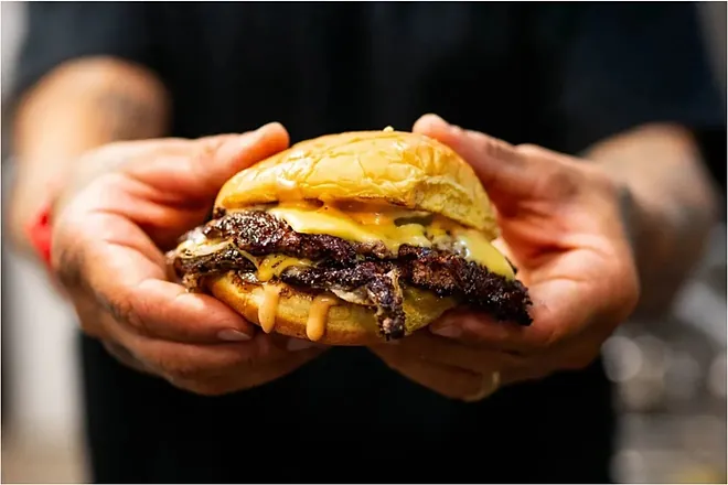 Not a Damn Chance Burger in Dallas: Why This Minimalist Spot Is Already a Texas Sensation 3 Juicy Texas Wagyu beef patty sizzling on the grill at NADC Burger